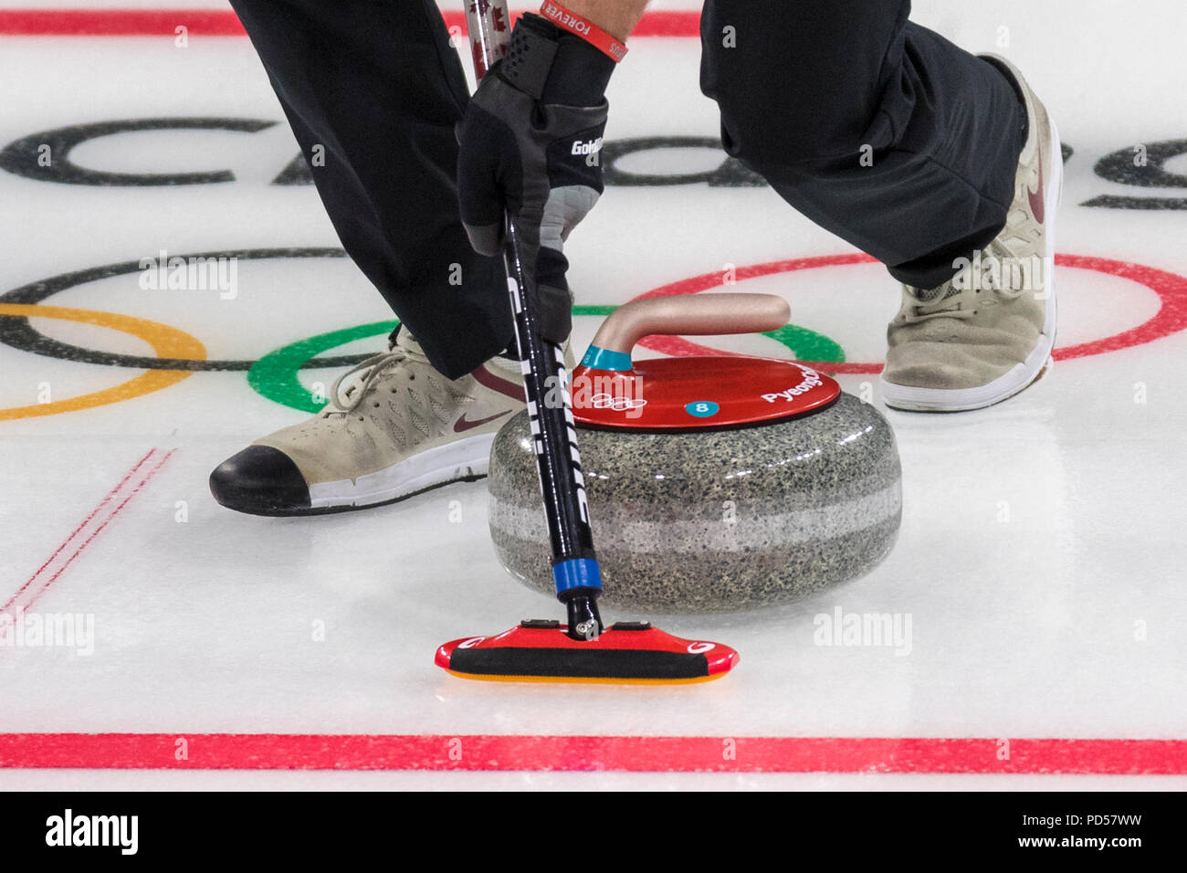 Detail of curling broom and stone at the Olympic Winter Games PyeongChang 2018 Stock Photo