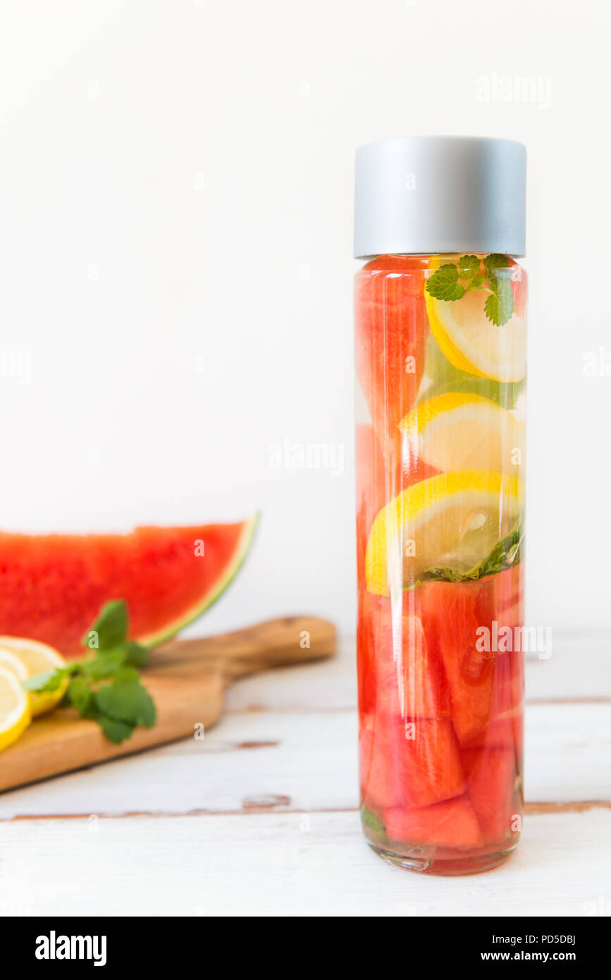 Detox Infused Water With Lemon Watermelon And Mint In Sports Bottle With Cut Pieces Of Lemon And Watermelon Nearby Stock Photo Alamy