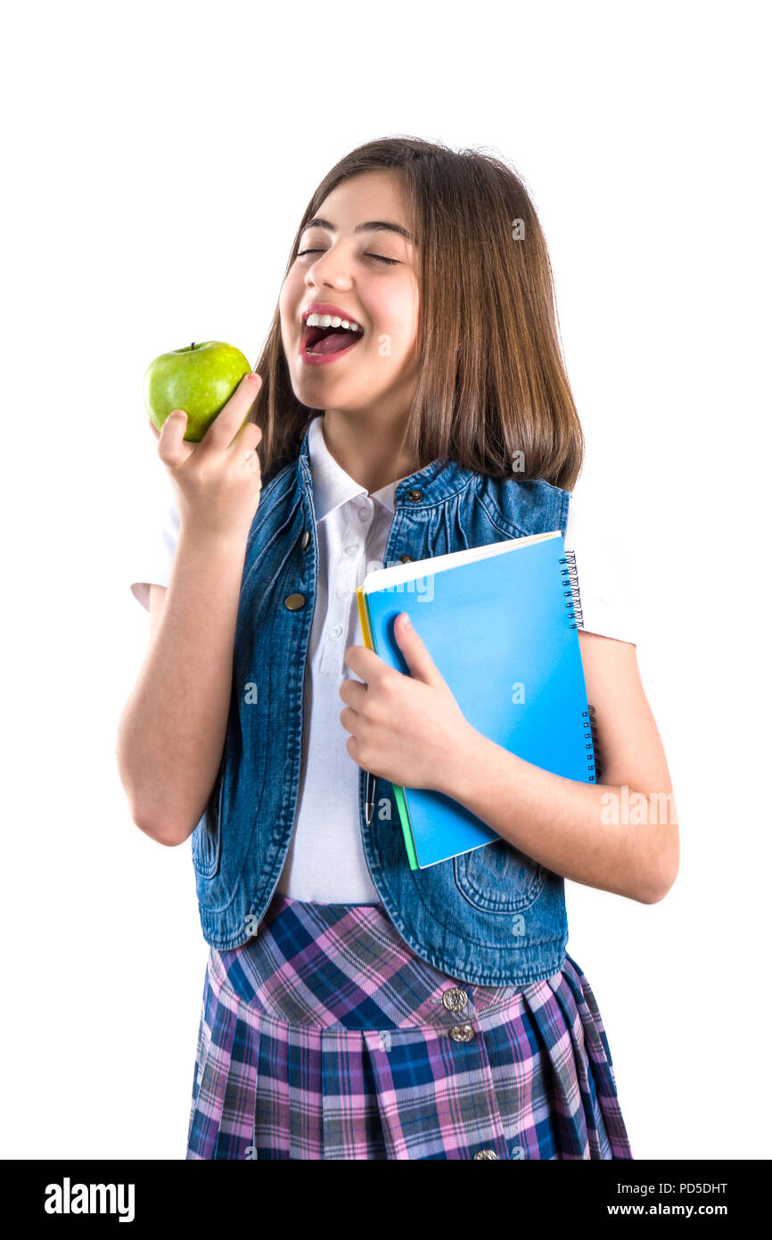 schoolgirl with notebook and apple on white background Stock Photo - Alamy
