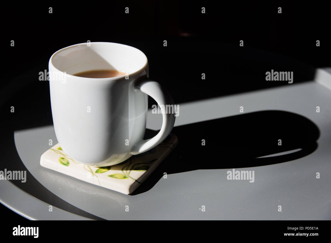 Early morning (or late afternoon) mug of tea, with room for captions Stock Photo