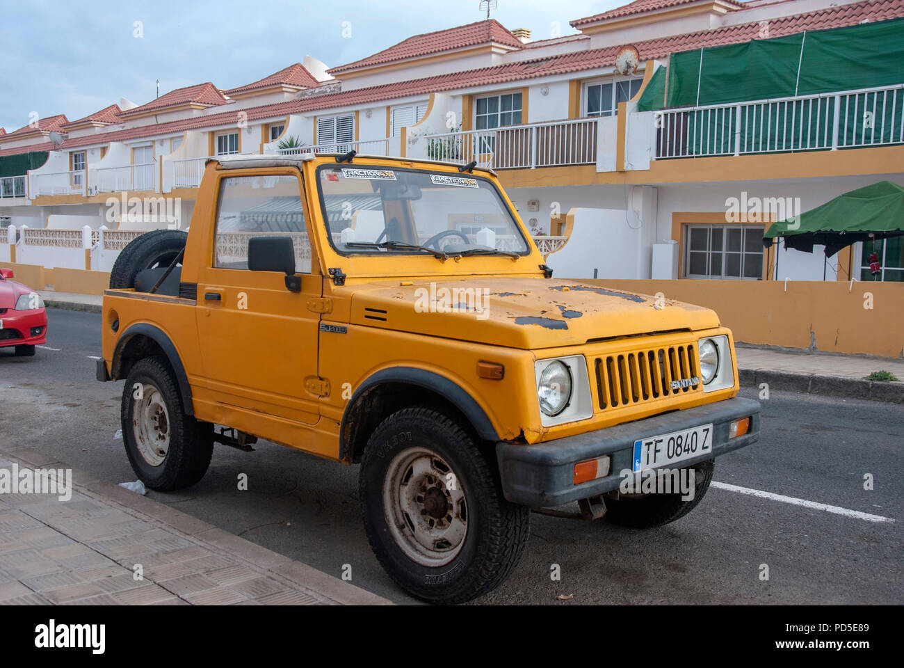 1990's Old Yellow Suzuki SJ410 Santana Soft Top Mini SUV front right hand  passenger side view of 1990's vintage yellow left hand drive lhd suzuki sj  4 Stock Photo - Alamy