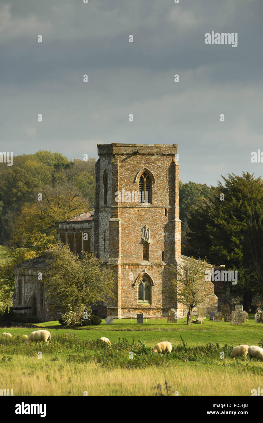 The medieval Church of St Mary the Virgin near Daventry, Northamptonshire, England, which is in a rural setting surrounded by fields and trees. Stock Photo