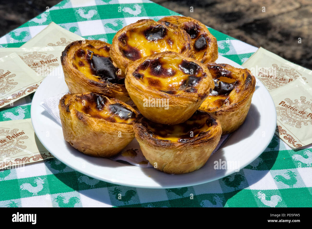 Portugal, pasteis da nata pastries - a speciality of Belem, Lisbon, on a street café table Stock Photo
