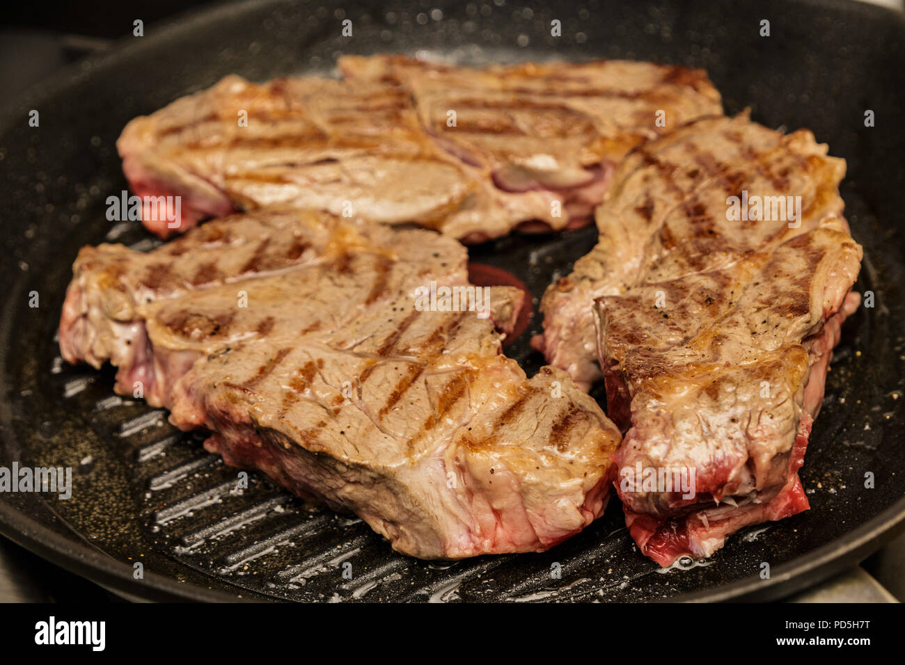 Three Chuck Steaks Turned on Grill Stock Photo Alamy