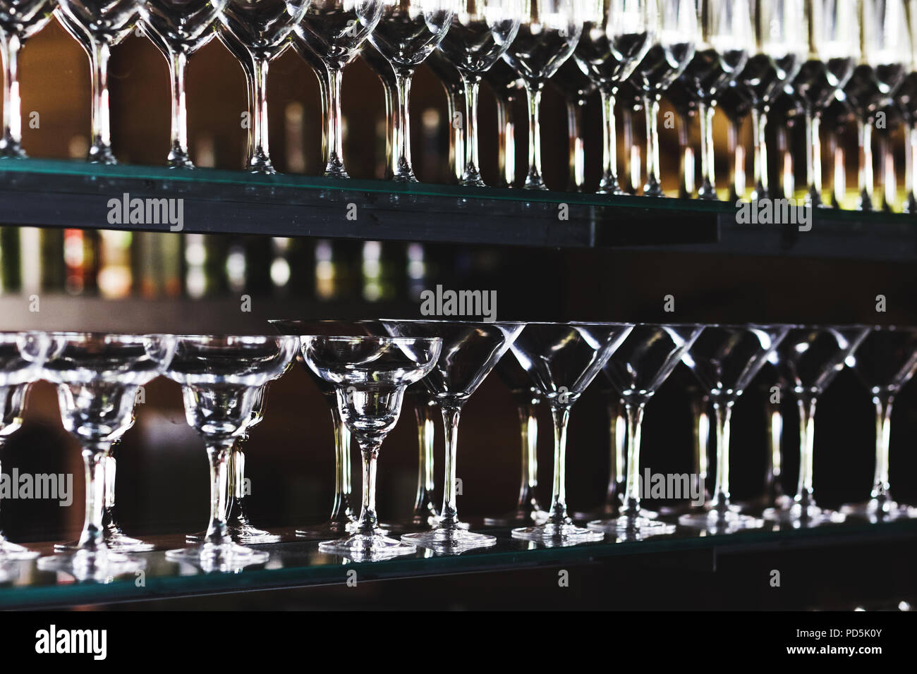 Set of glasses in the bar on a dark background Stock Photo Alamy