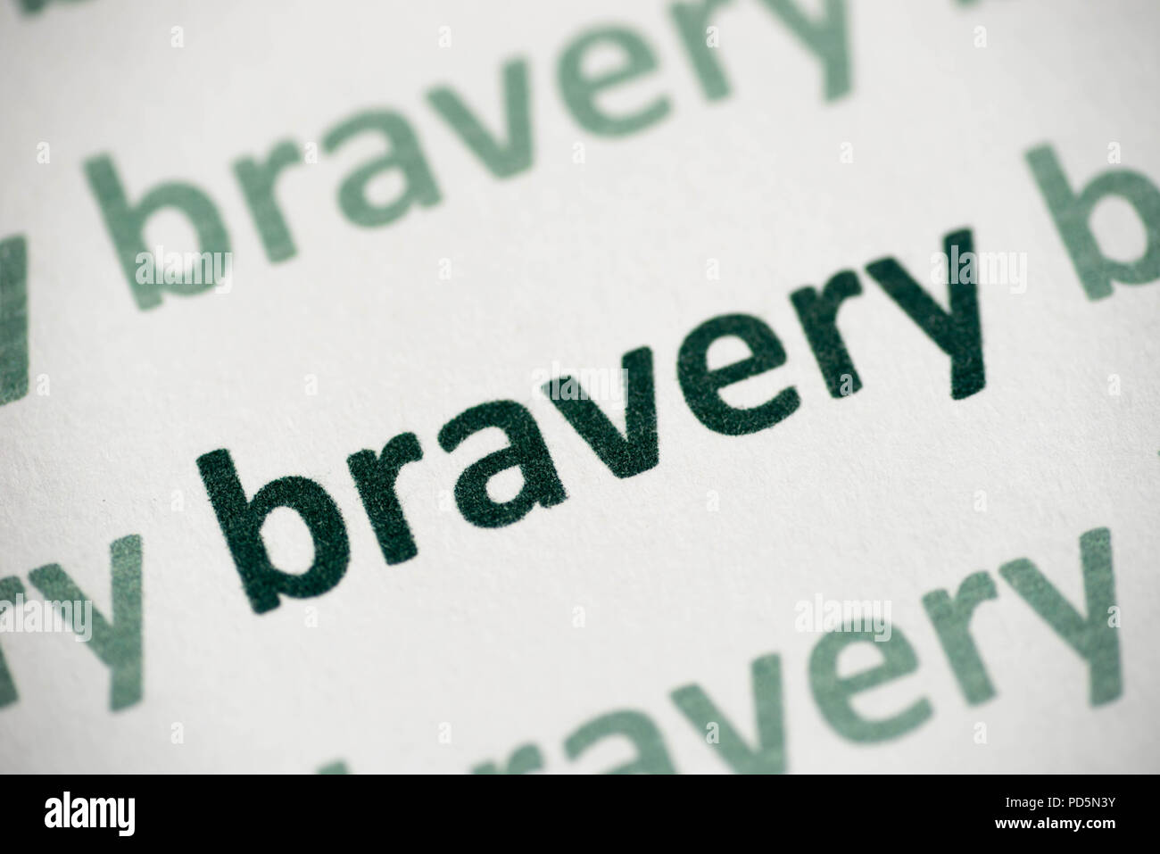 word bravery printed on white paper macro Stock Photo