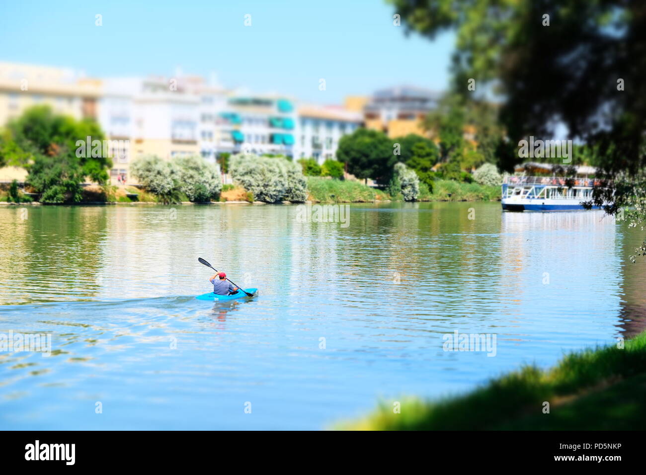 Canoeing on the river Guadalquivirin Seville Stock Photo