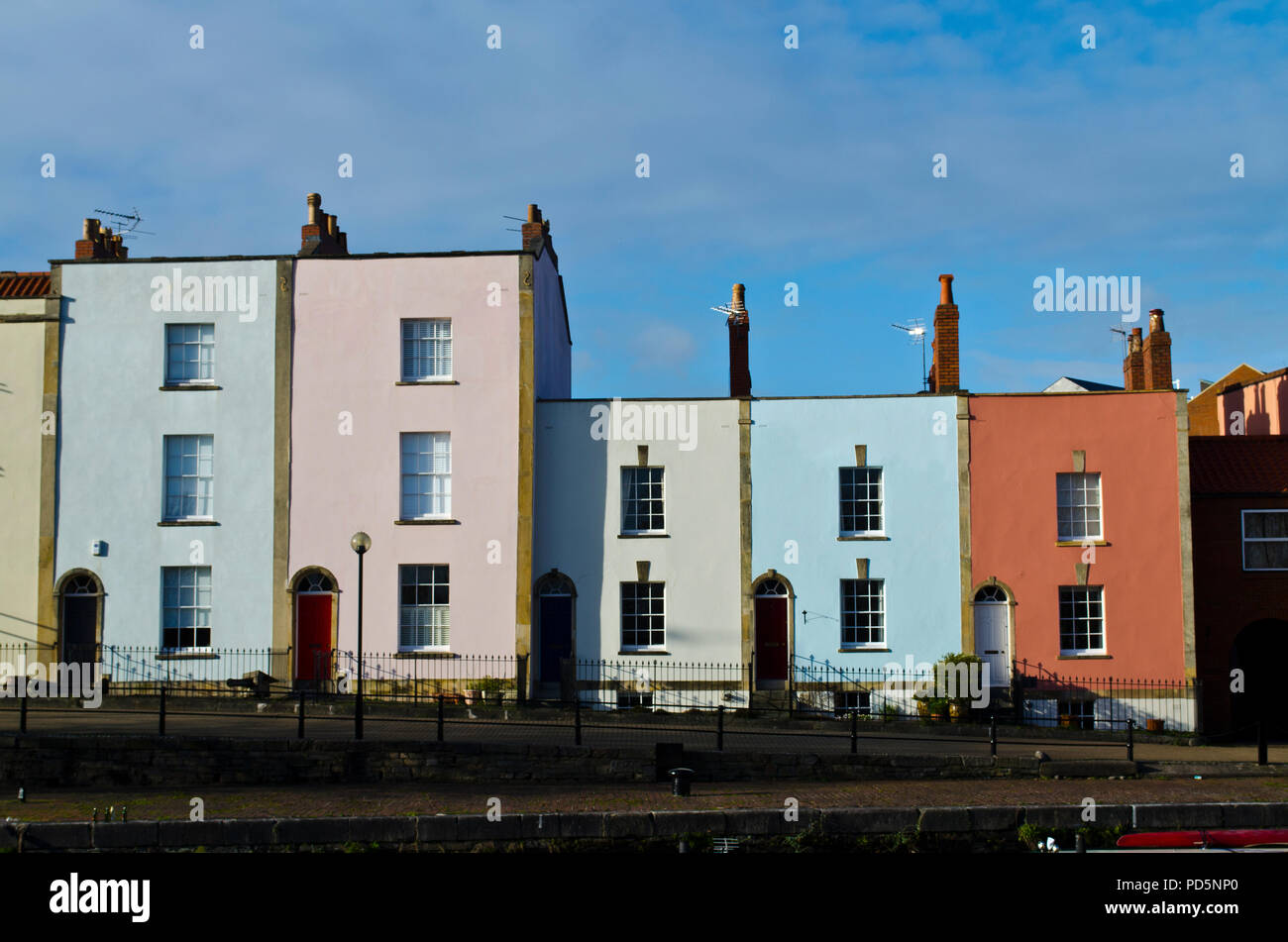 Terrace of five georgian houses, painted in pastel colours, two are three storey and three are two storey Stock Photo