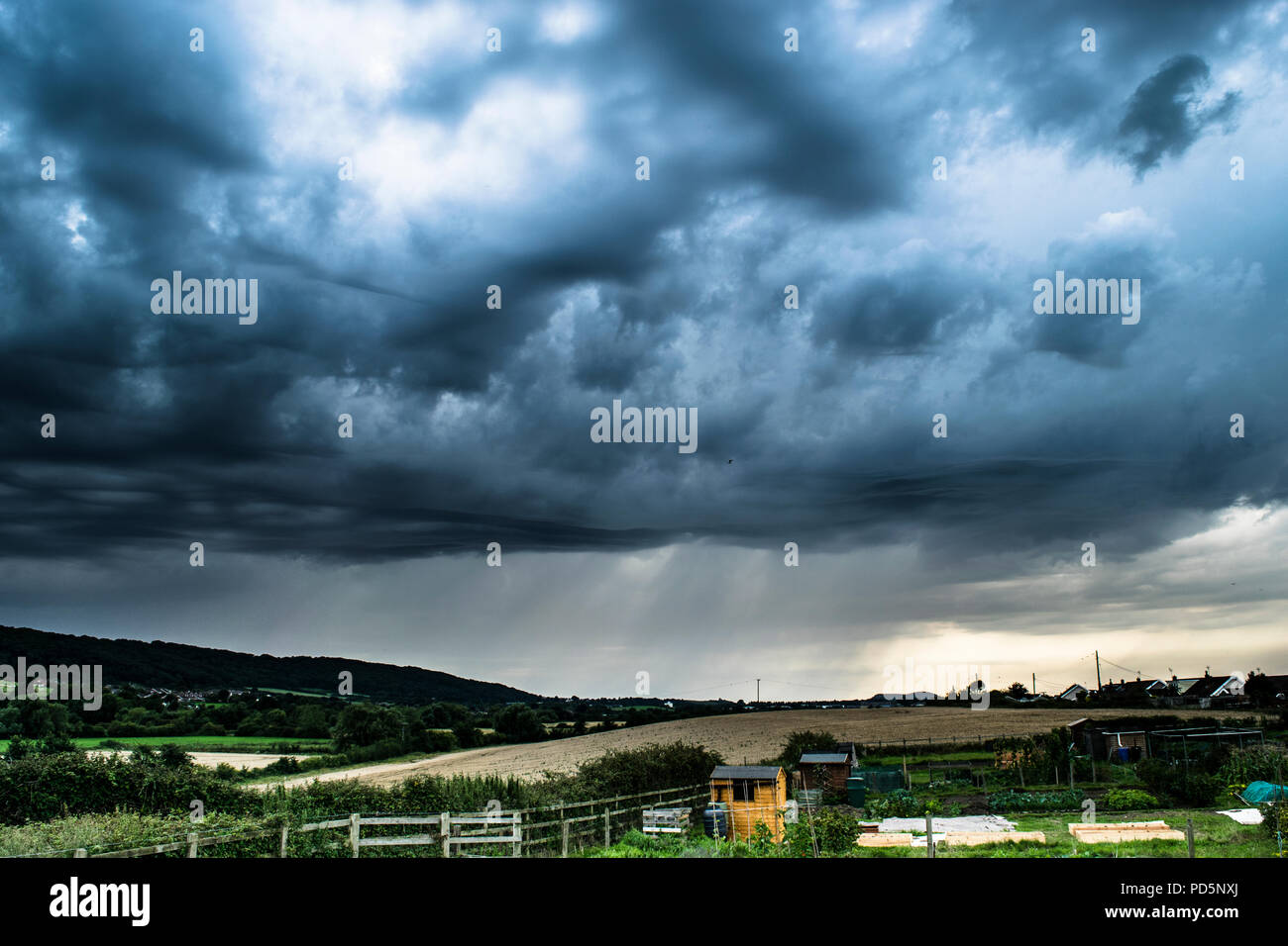 dark and brooding rain storm over somerset countryside Stock Photo