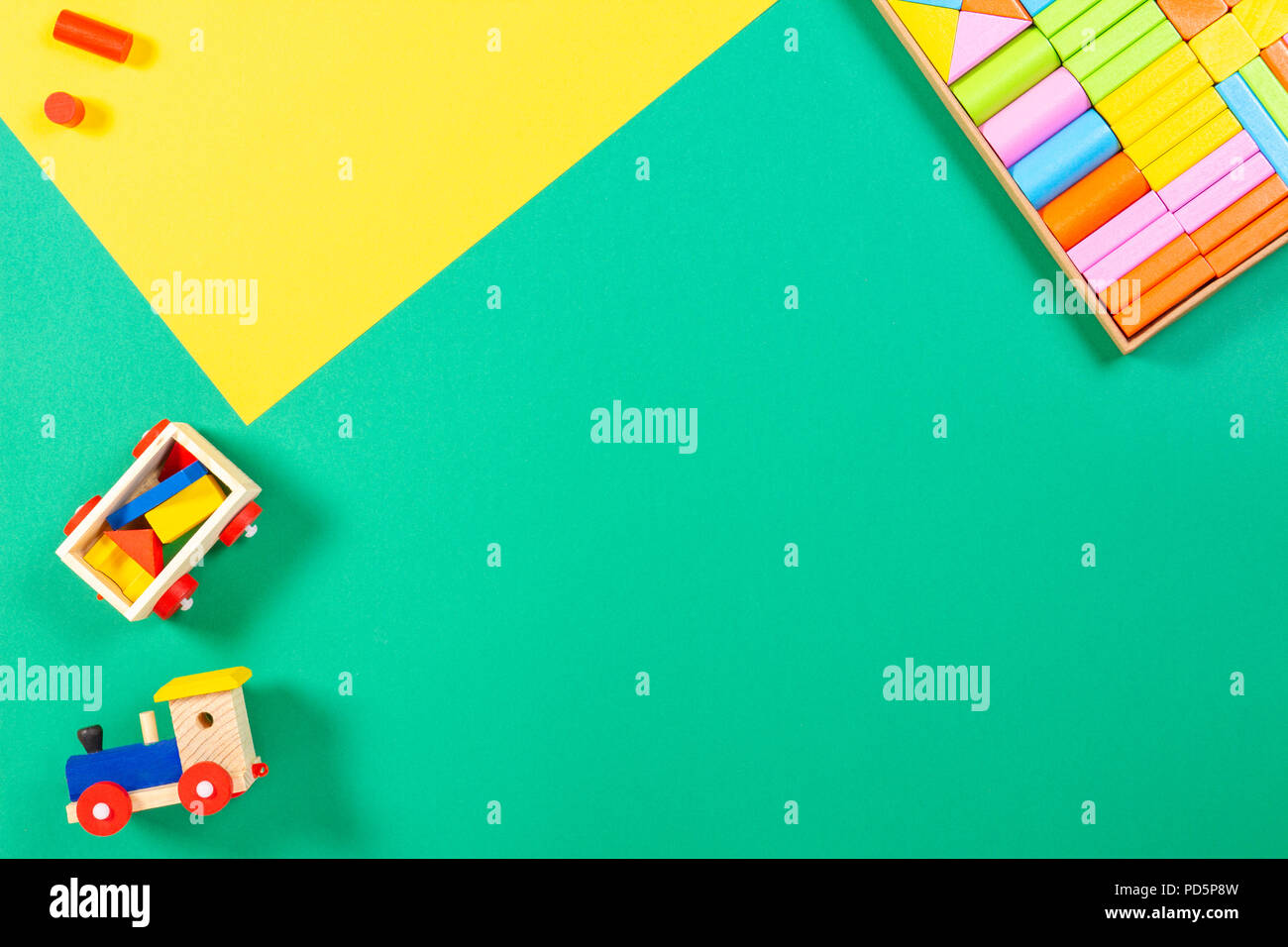 Toy train and wooden blocks on colorful background Stock Photo - Alamy