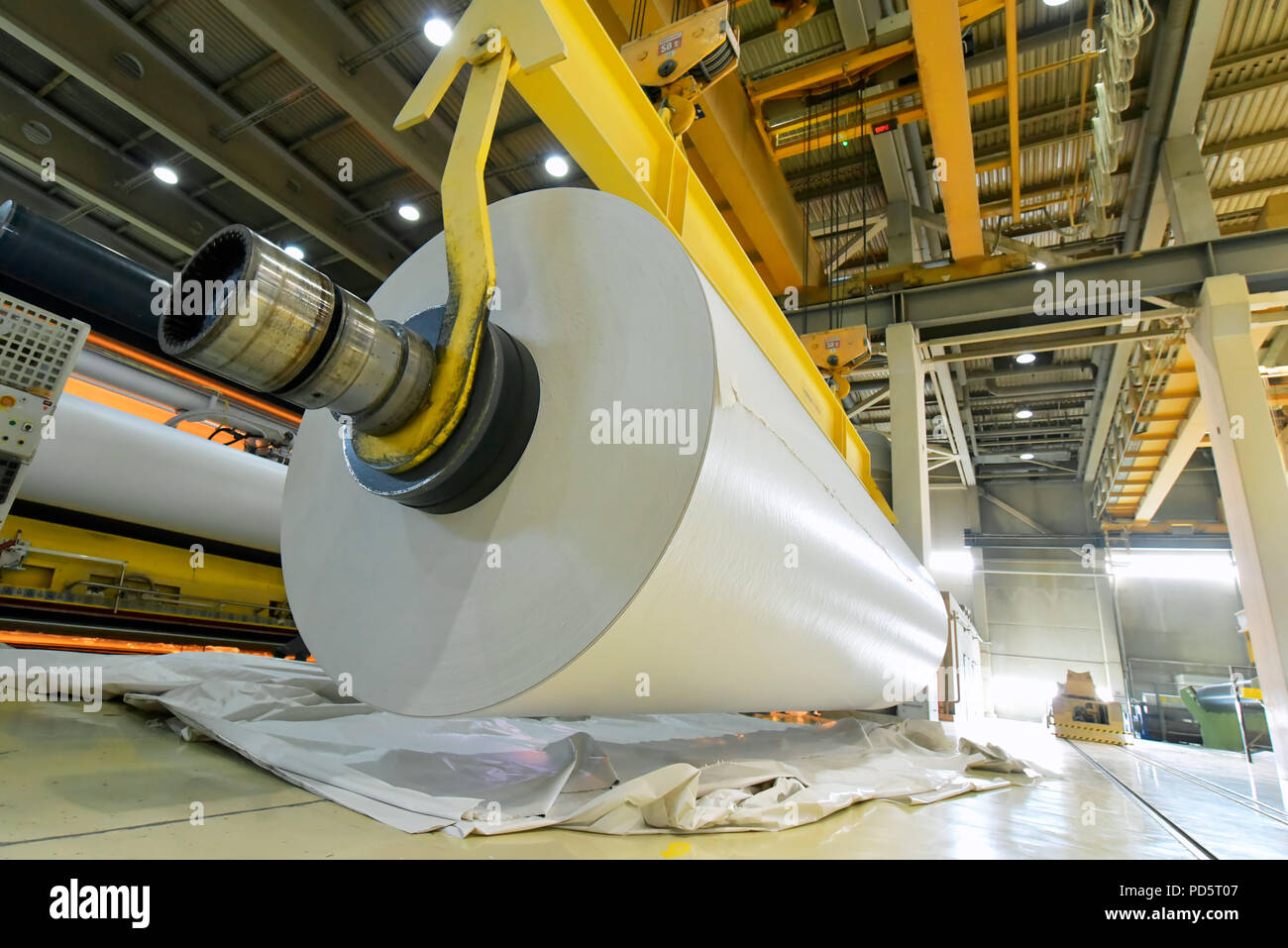 machines for the production of paper rolls for further processing in a printing plant - recycling of waste paper Stock Photo