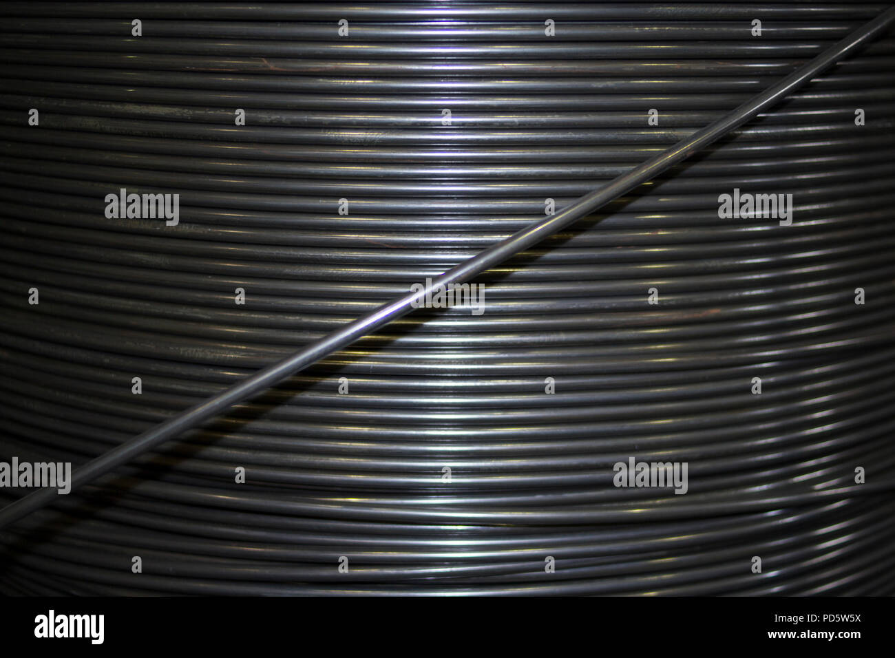 Coil of thick 6 8 10 mm industrial steel wire Stock Photo Alamy