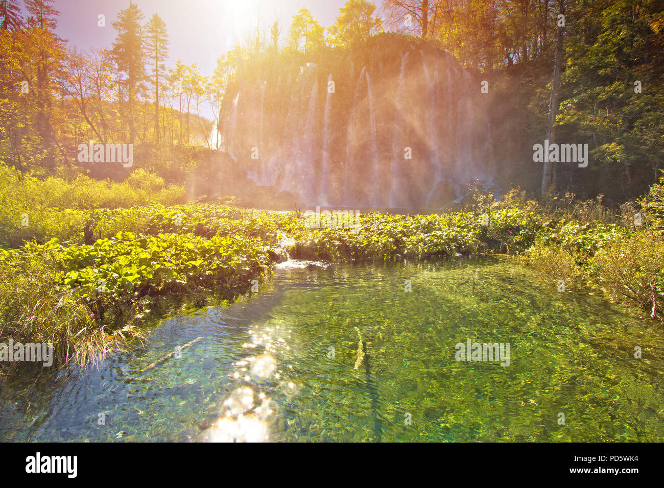 Plitvice lakes national park great watefrall splashing at sun haze, Croatia Stock Photo