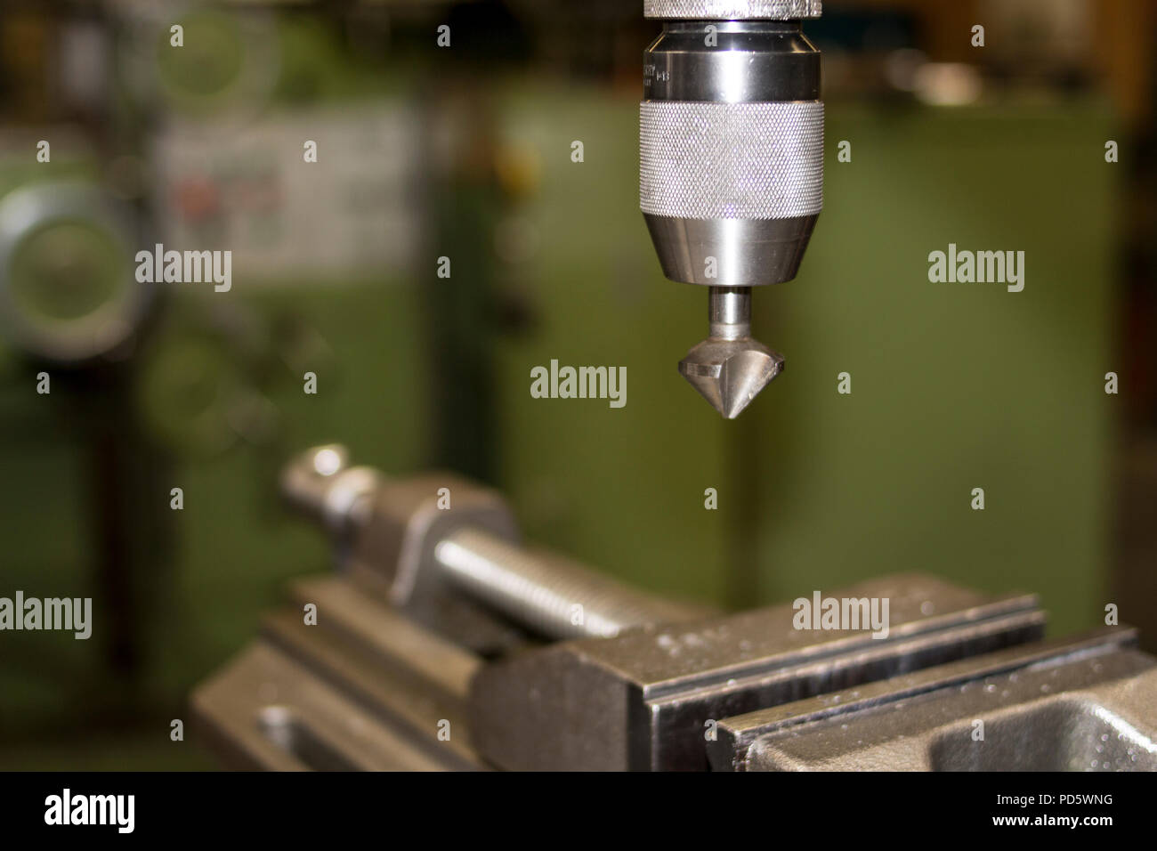 Industrial classic green machine with vice in for metal craft