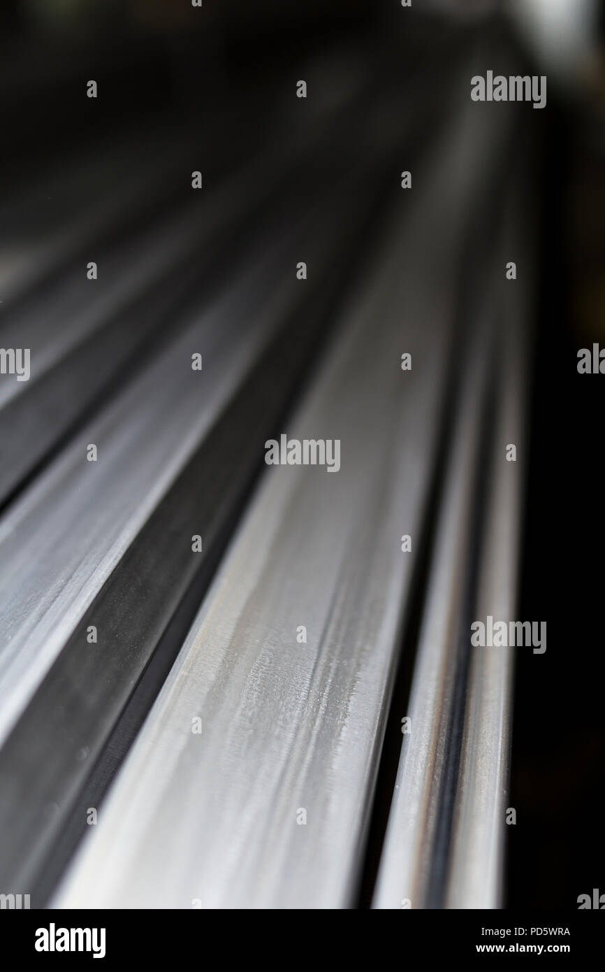 Industrial square steel metal bars tubes metallic texture Stock Photo
