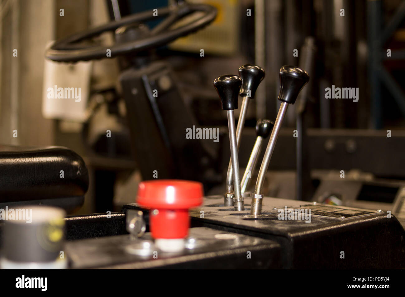 Used forklift wheel cockpit in an industrial company service levers