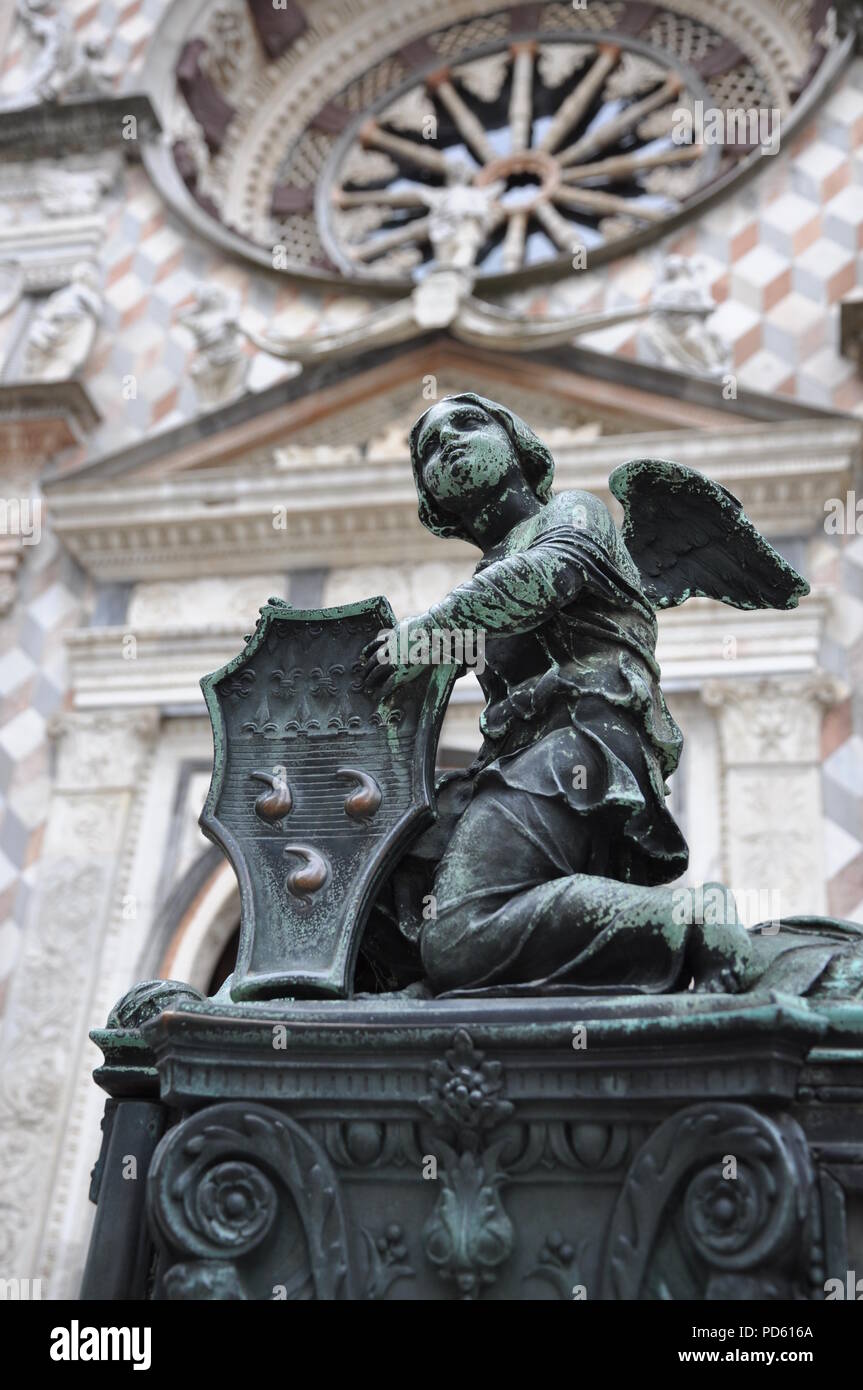 Angel sculpture on gate to cathedral in Bergamo Stock Photo