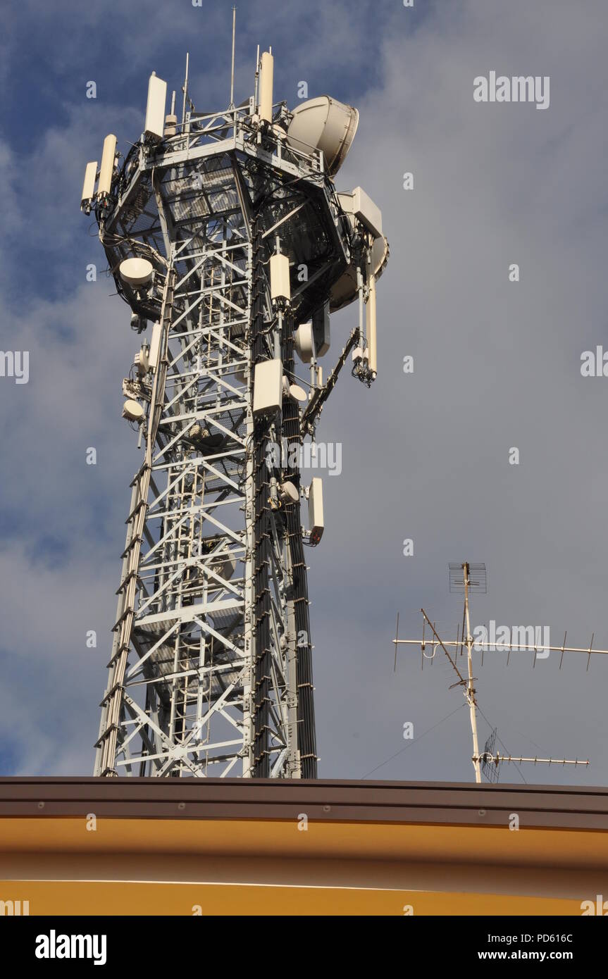 tower with antennas over the top of a building Stock
