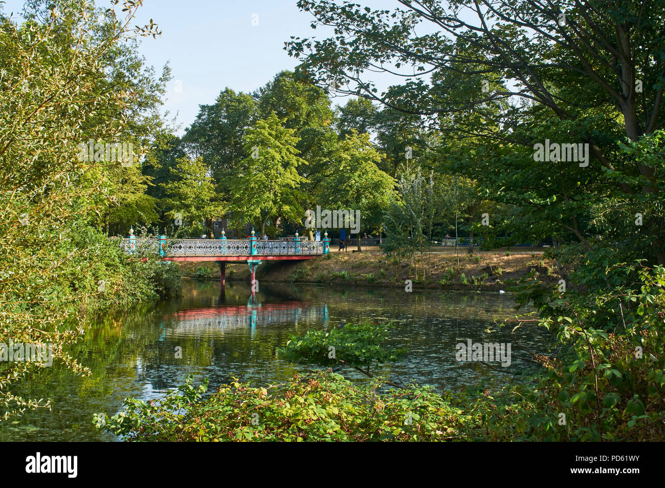 Bridge over the lake in Victoria Park, East London, UK, in early August