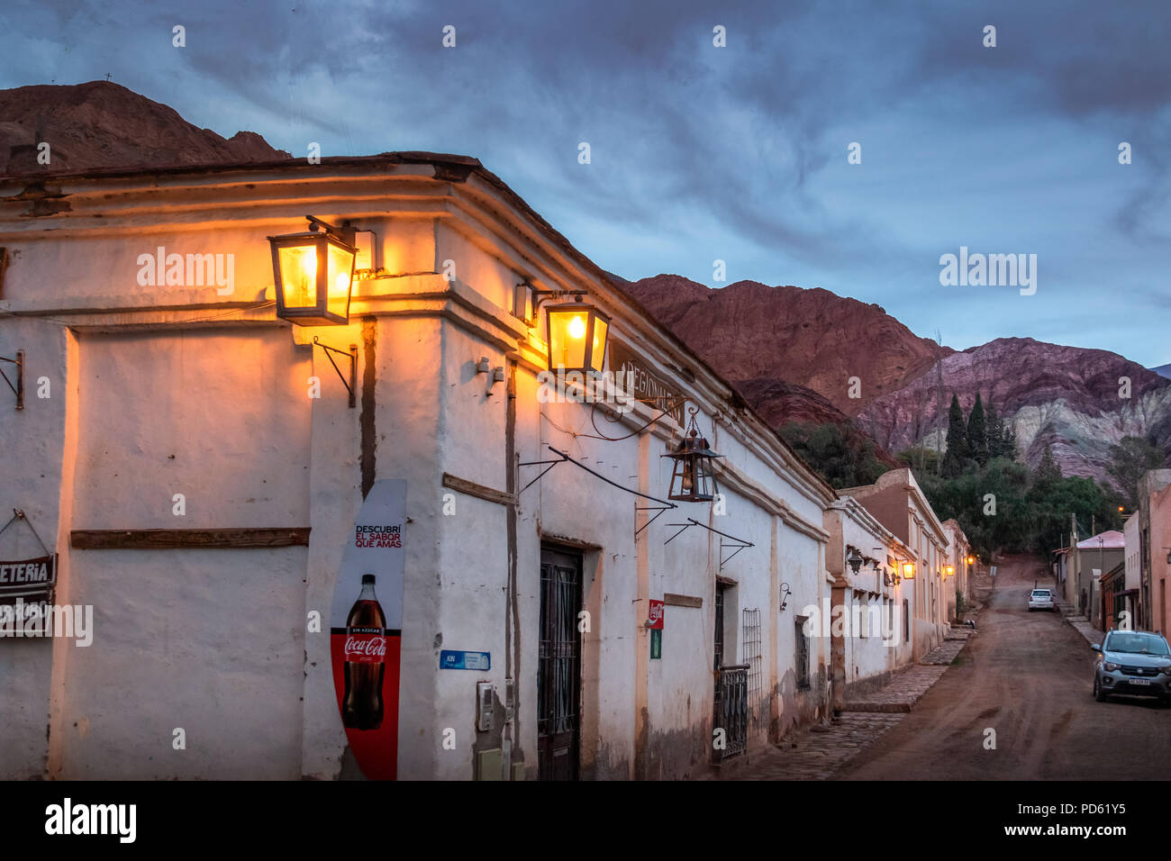 Purmamarca town at night with the Hill of Seven Colors (Cerro de los siete colores) on background  - Purmamarca, Jujuy, Argentina Stock Photo