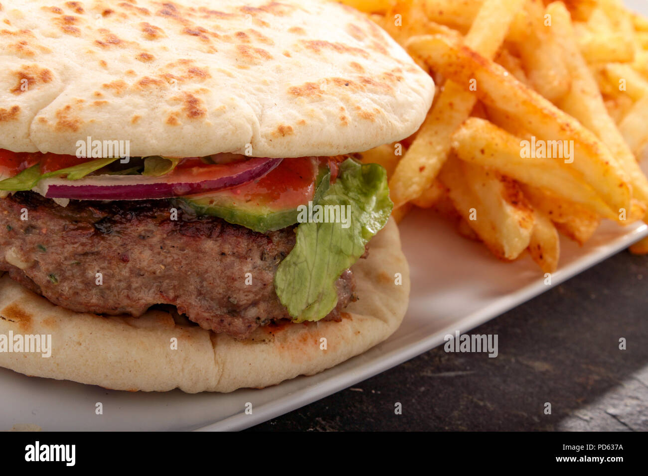 Indian style kofte burger in naan bun Stock Photo