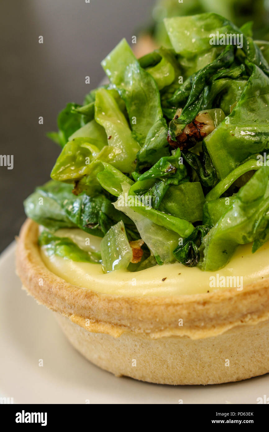 braised cabbage and cheese tartlet Stock Photo Alamy