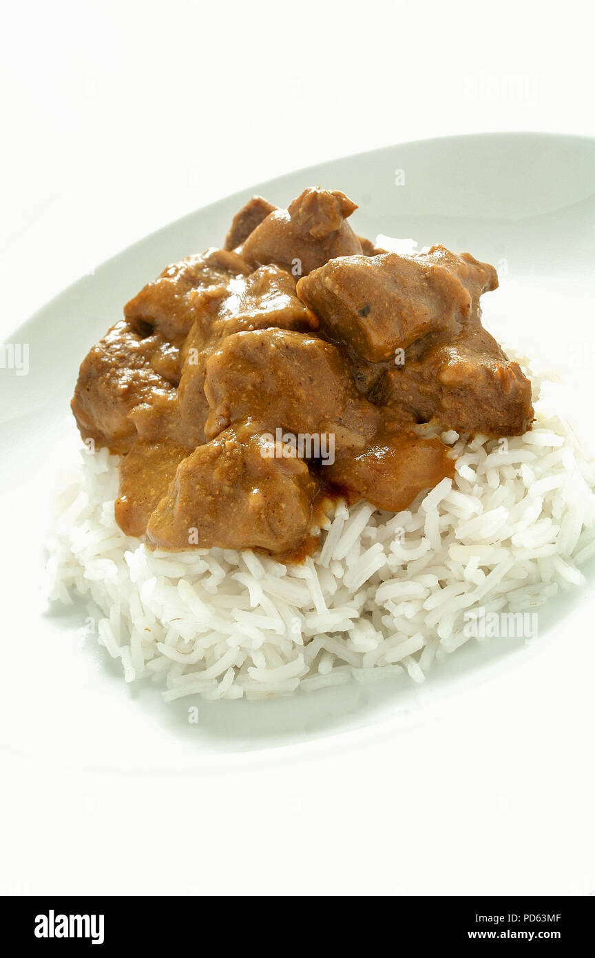 jamaican goat curry with boiled rice Stock Photo