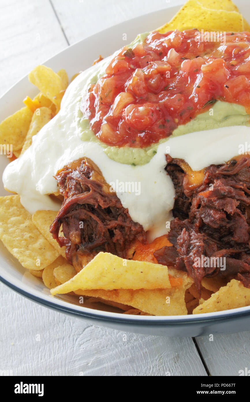 tortilla chips with pulled pork Stock Photo Alamy