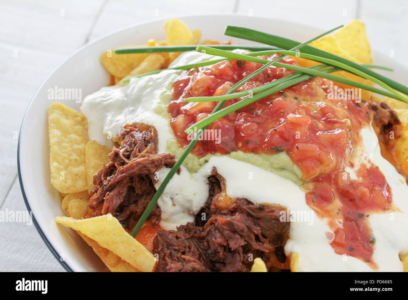 tortilla chips with pulled pork Stock Photo Alamy