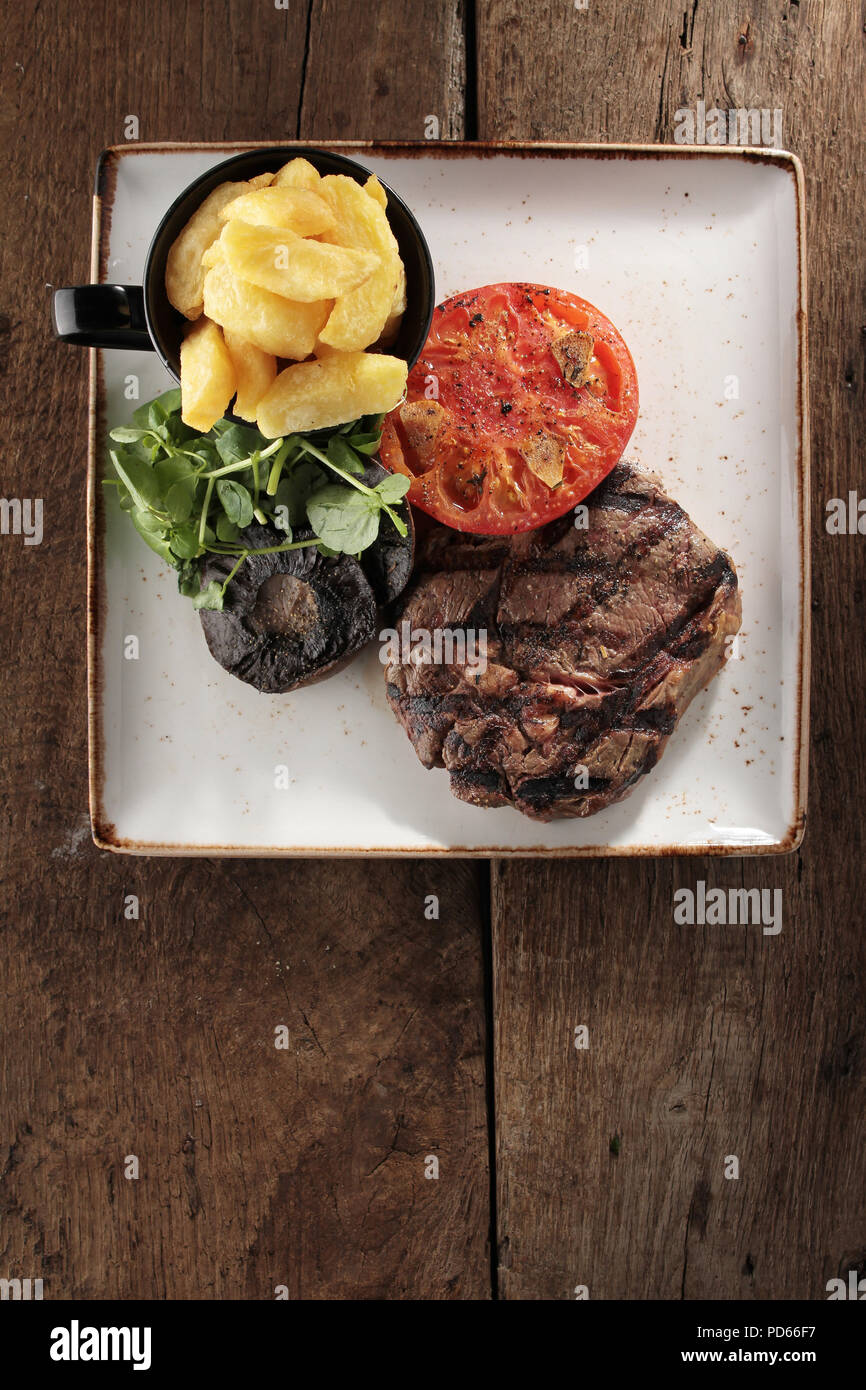 plated rib eye steak dinner Stock Photo Alamy