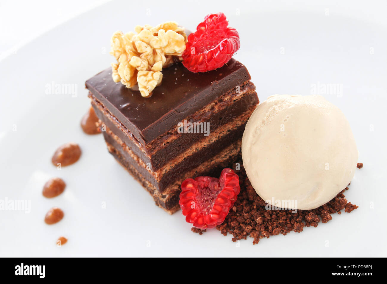 plated layered chocolate cake dessert Stock Photo Alamy