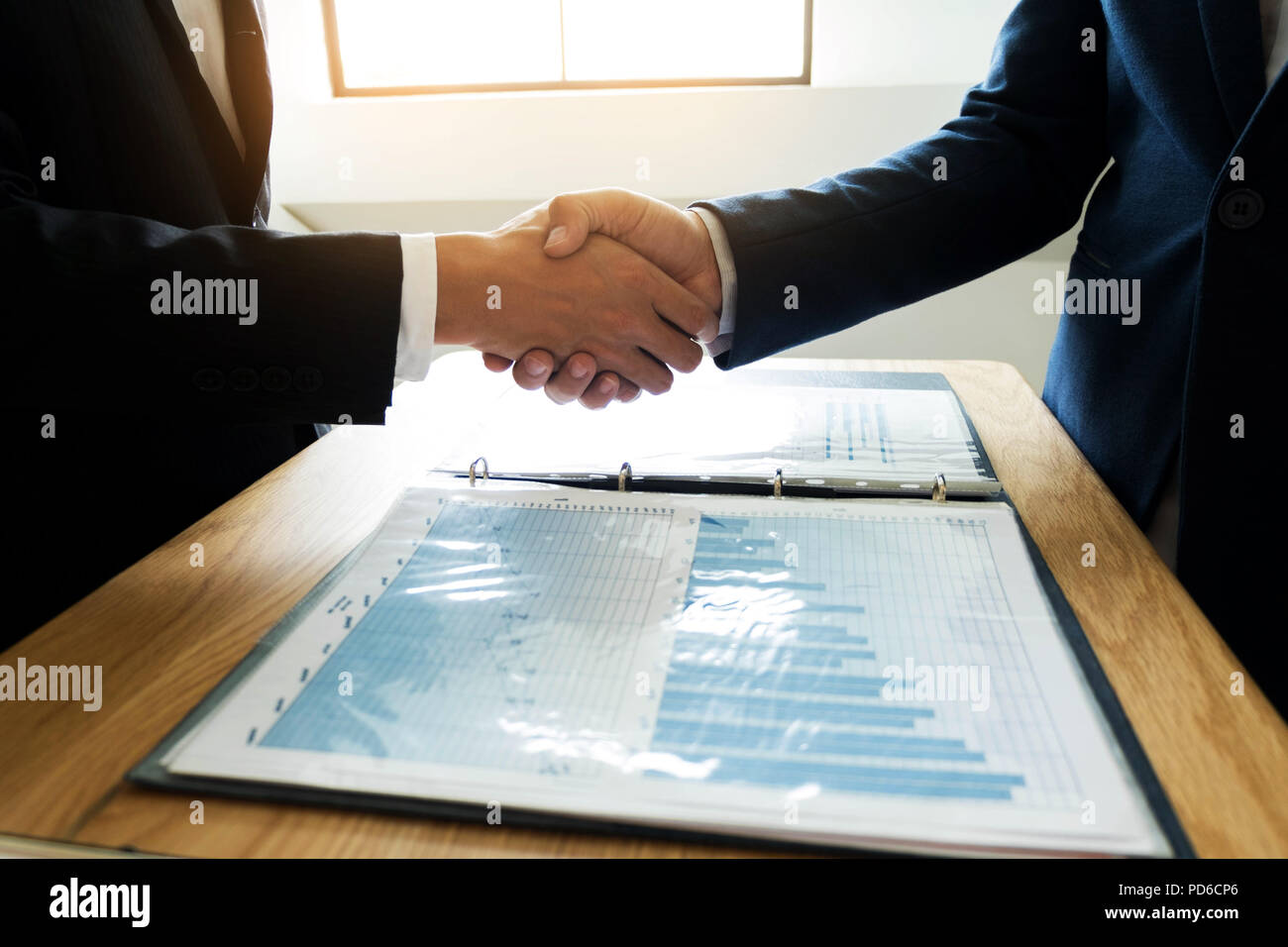 Business handshake. Business people shaking hands, finishing up a meeting,Success agreement negotiation. Stock Photo