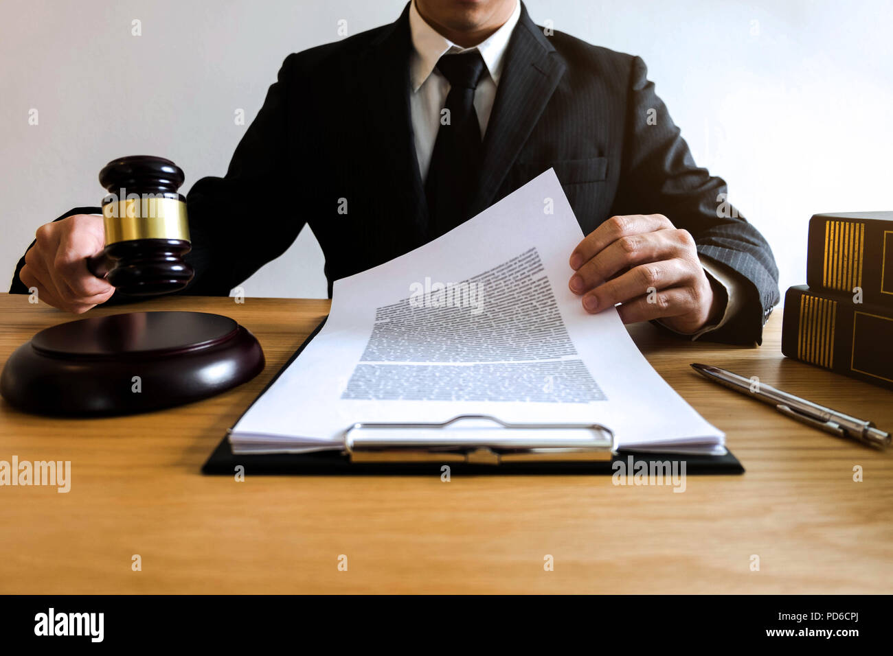 Lawyer working with contract papers on the table in office. consultant lawyer, attorney, court judge, concept. Stock Photo