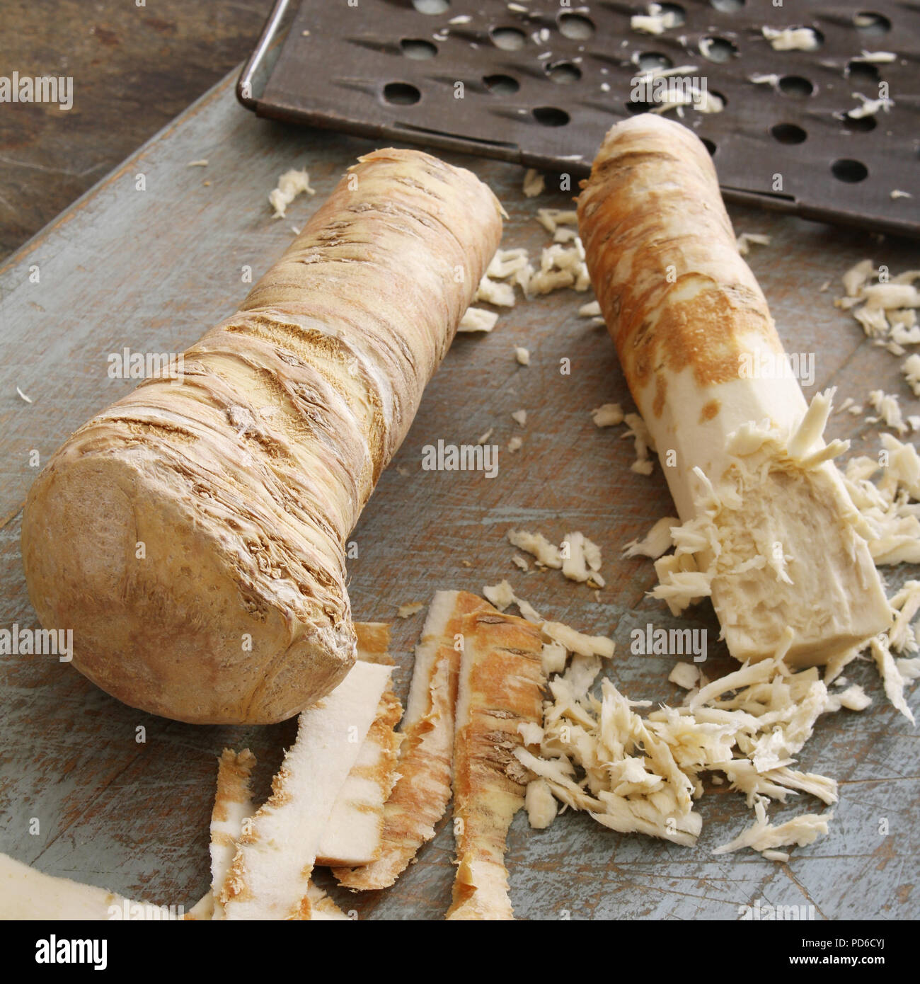 grating fresh horseradish root Stock Photo Alamy