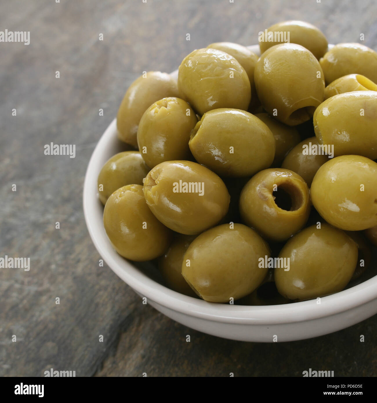 Pitted green olives in dish hi-res stock photography and images - Alamy