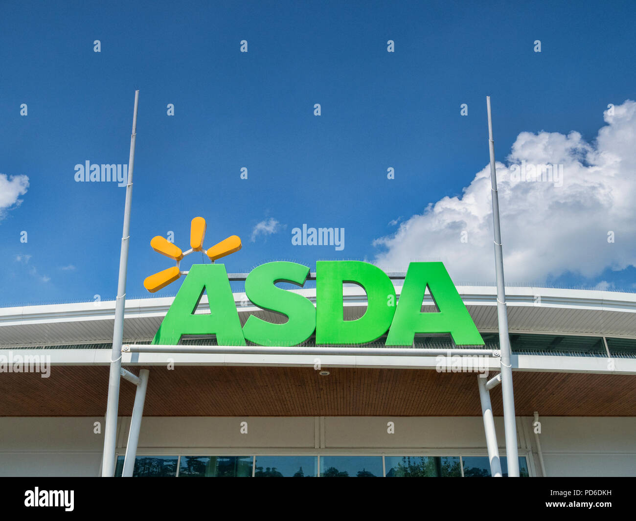 28 May 2018: Newton Abbot, Devon, UK - Asda logo against blue sky. Stock Photo