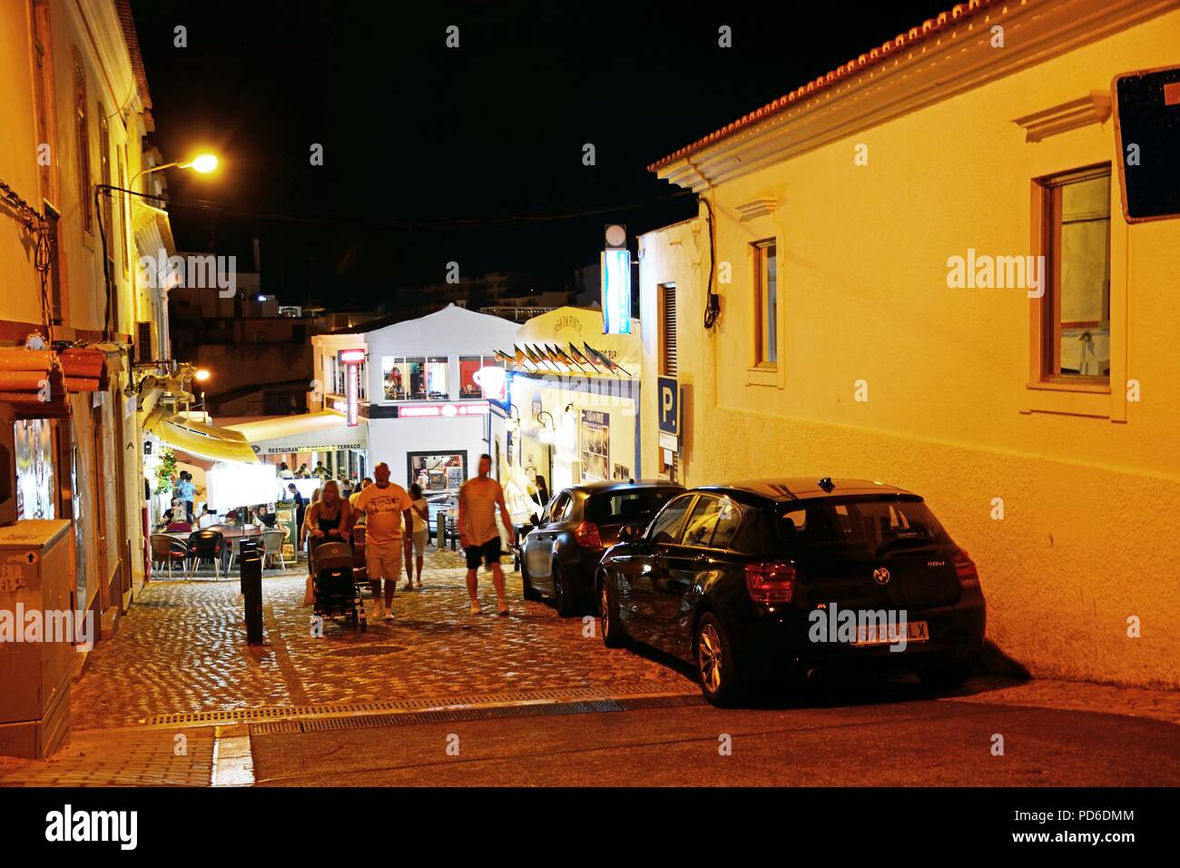 Restaurants in the old town at night with tourists enjoying the setting
