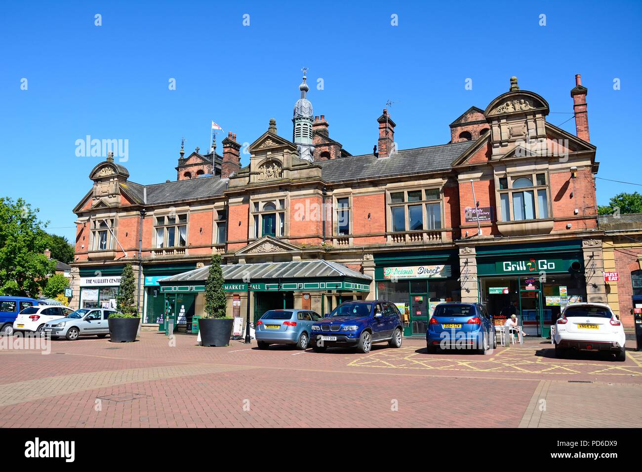 The Victorian Market Hall in the town centre with cars parked in the foreground, Burton upon Trent, Staffordshire, England, UK, Western Europe. Stock Photo