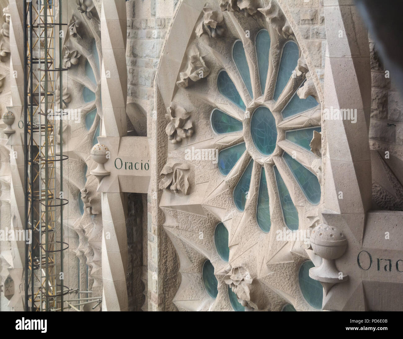 Barcelona, Spain - May 9, 2018: Exterior element - stained glass window - of the Sagrada Familia, large unfinished Roman Catholic church in Barcelona, Stock Photo