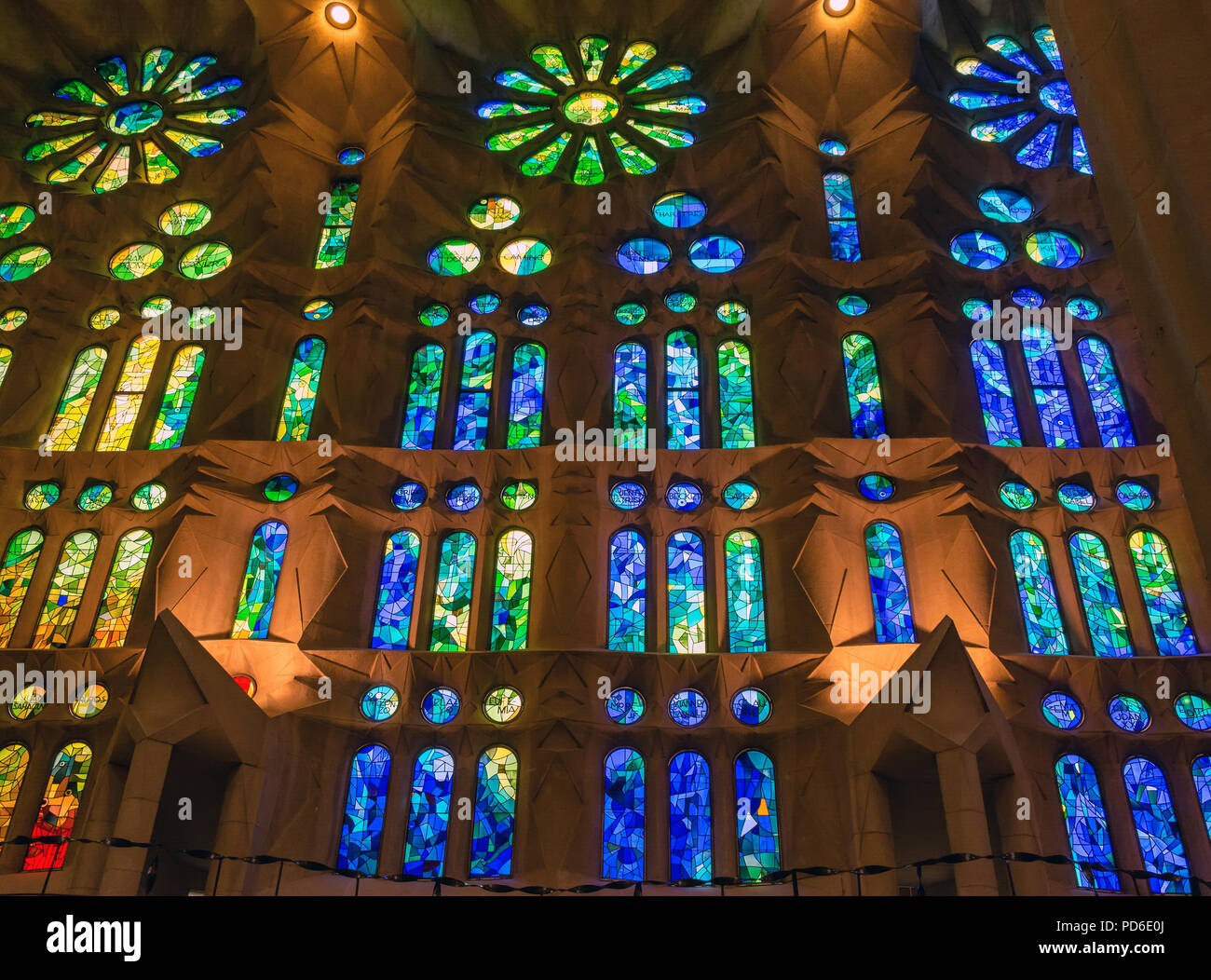 Colorful stained glass window of the Sagrada Familia large unfinished Roman Catholic church in