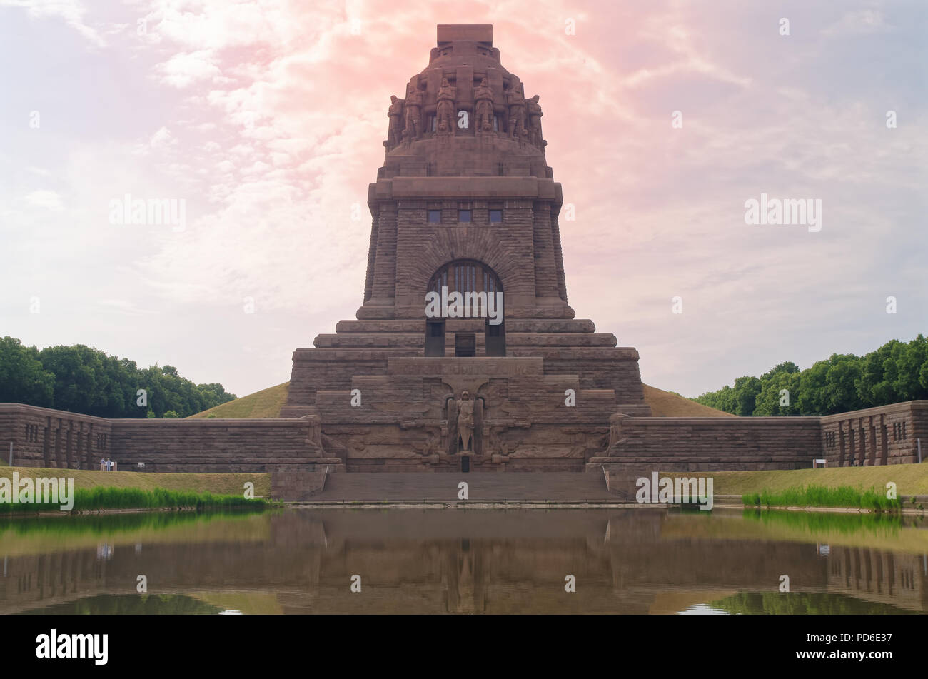 Dramatic red sky over monument to the Battle of the Nations (Das Völkerschlachtdenkmal), Leipzig, Germany. Designed by Bruno Schmitz Stock Photo