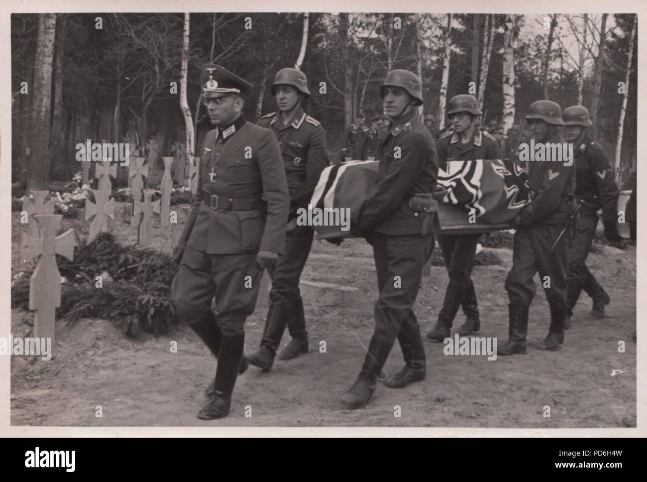 Image from the photo album of Oberleutnant Oscar Müller of  Kampfgeschwader 1: Captioned 'I had a comrade….', this photo shows the Chaplain of II./KG 1 leading the funeral cortege for a fallen comrade, Russia 1941. Stock Photo