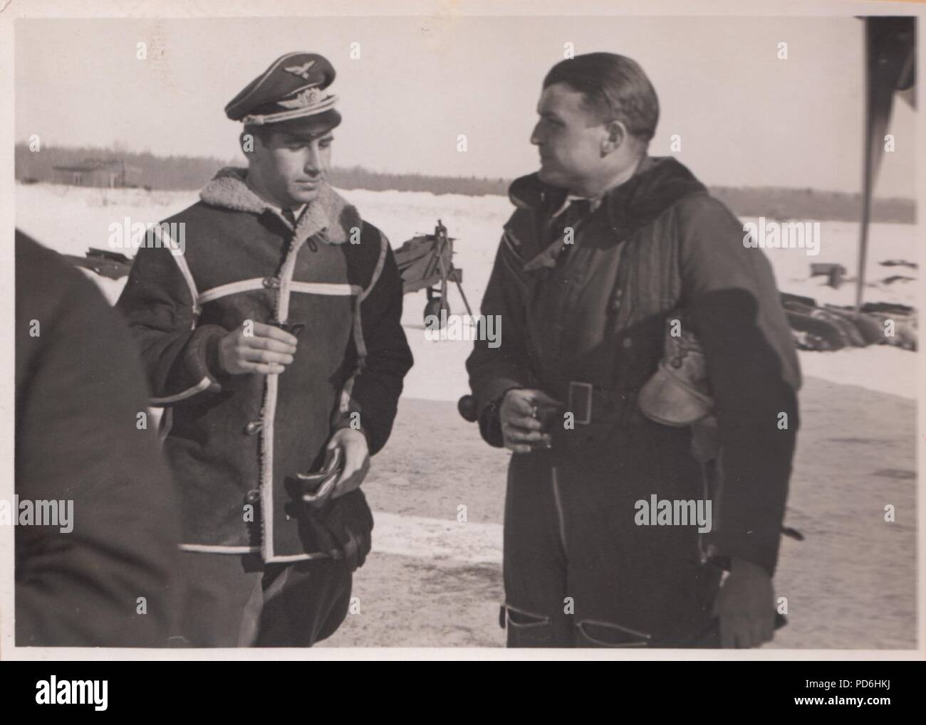 Image from the photo album of Oberleutnant Oscar Müller of  Kampfgeschwader 1: Oberleutnant Hans Sumpf (on right) at Dno Airfield in Russia in 1942. Sumpf was Staffelkapitän of 5./KG1 from 7th October 1941 until his death on 26th March 1942. He was posthumously awarded the Ritterkreuz (Knight's Cross of the Iron Cross) on 20th August 1942. Stock Photo