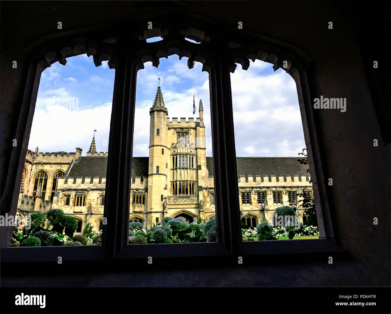 Sunlit summer view of Founder's Tower and garden of Magdalen College Oxford thru Cloisters Stock Photo