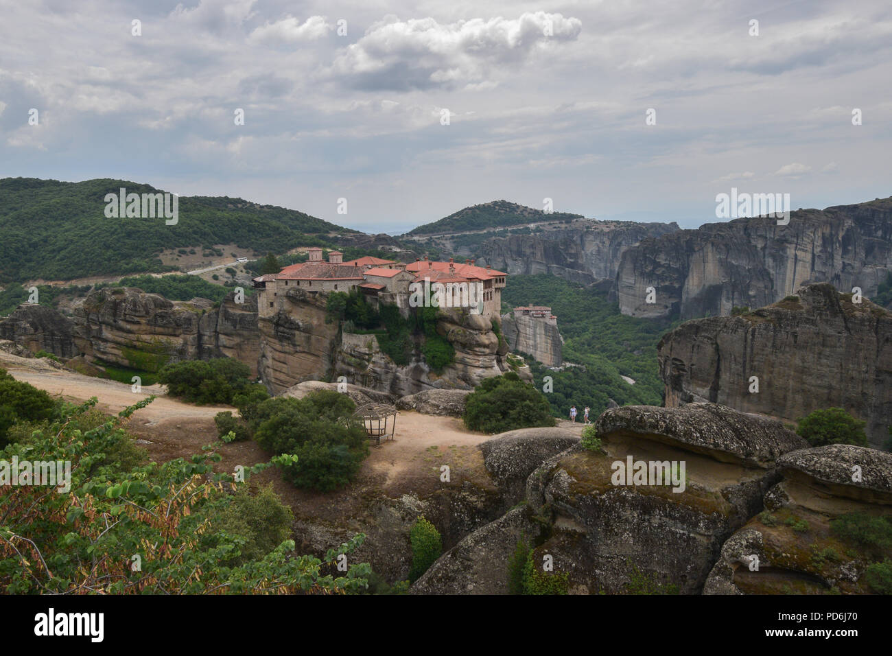 The Meteora is a rock formation in central Greece hosting one of the largest and most precipitously built complexes of Eastern Orthodox monasteries. Stock Photo