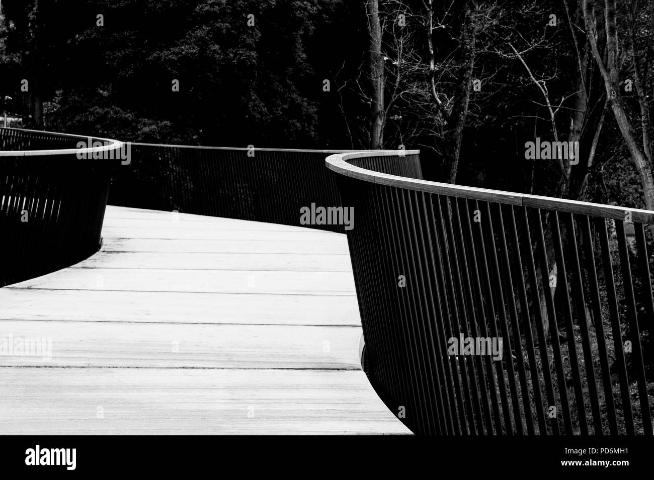 Black And White Bridge Walkway With Metal Railing And Wooden Boards Bw