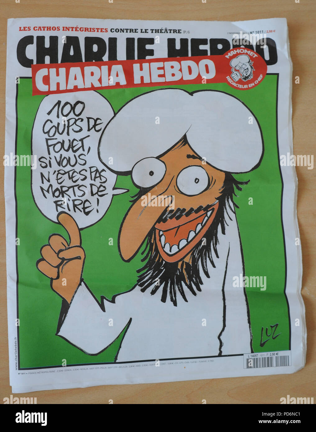 November 2, 2011 - Paris, France: Cover page of the French satirical weekly paper Charlie Hebdo. The weekly paper's office was destroyed in a petrol bomb attack after publishing a caricature of prophet Muhammad on its front cover for a special issue entitled 'Sharia Hebdo'.  Couverture du numero special Charia Hebdo, par les dessinateurs de Charlie Hebdo. Une attaque au cocktail molotov a declenche un incendie et detruit les locaux boulevard Davout de l'hebdomadaire satirique. Cette attaque fait suite a l'annonce par Charlie Hebdo de la sortie d'un numero special 'Charia Hebdo' avec des carica Stock Photo