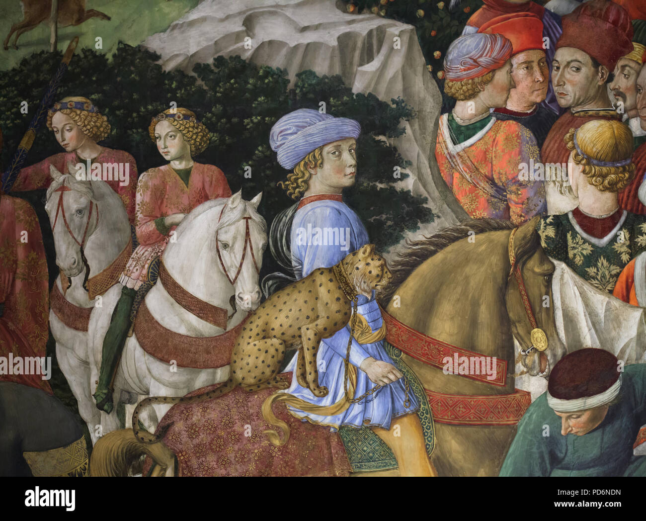 Giuliano de' Medici with a tame cheetah behind him on horseback depicted in the mural by Italian Renaissance painter Benozzo Gozzoli in the Magi Chapel in the Palazzo Medici Riccardi in Florence, Tuscany, Italy. Stock Photo