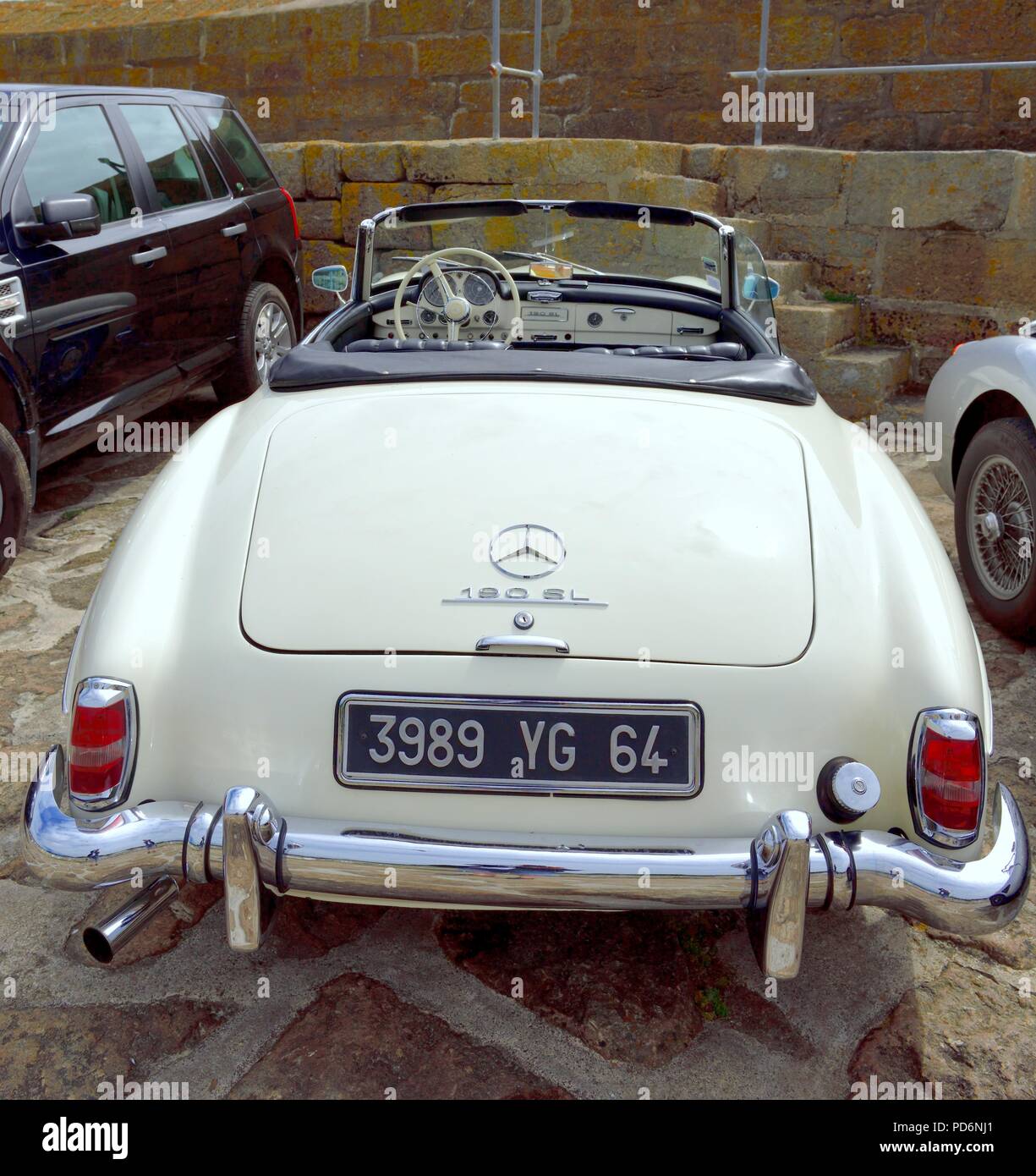 Mercedes 190 SL 2 door Roadster Classic Car parked up the fishing village of Mousehole,Cornwall,England,UK Stock Photo