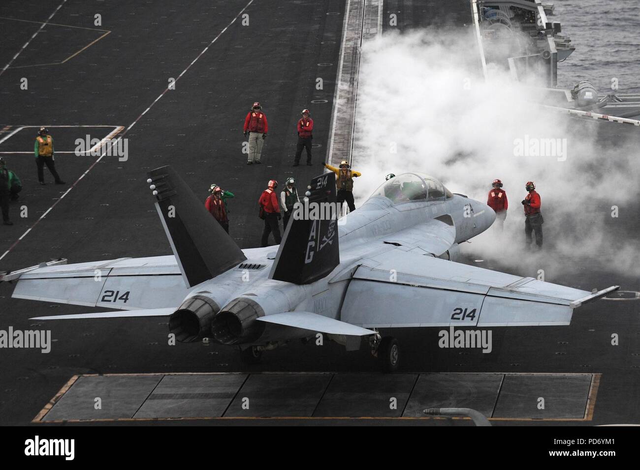 An F-A-18F is directed to a catapult at sea. (8576450595). Stock Photo